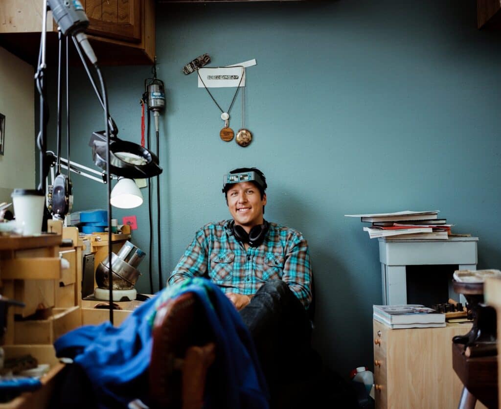 A man sitting in his work area.