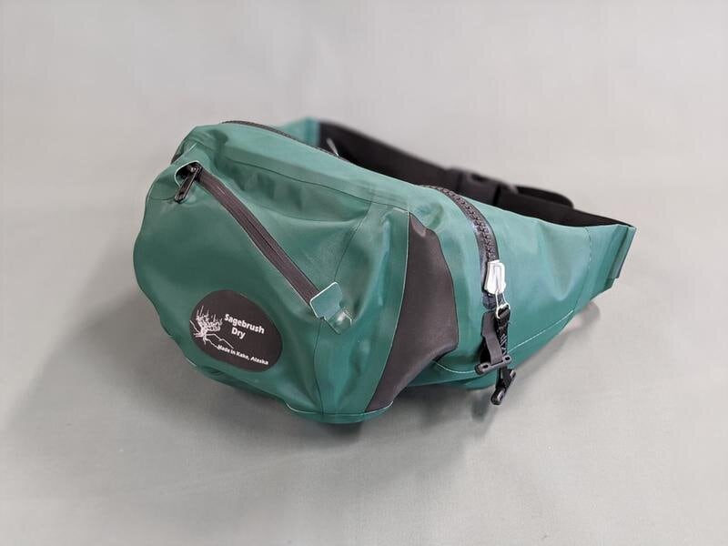 A green fanny bag with a black zipper.