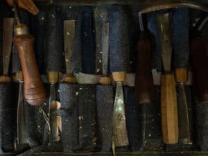 Woodworking tools surrounded by sawdust.