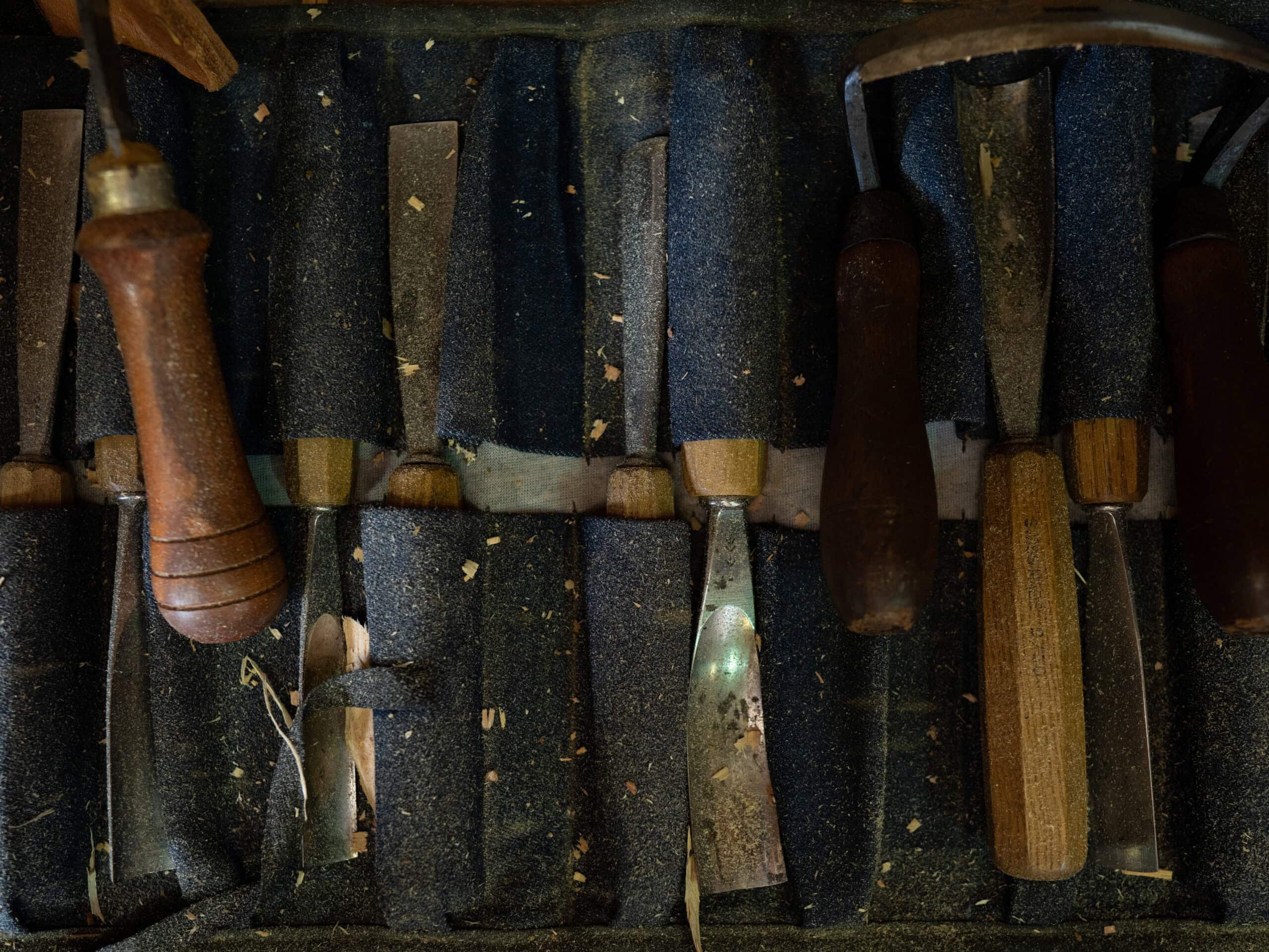 Woodworking tools surrounded by sawdust.